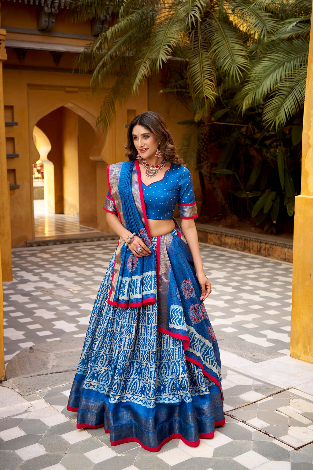 Blue Dola Silk lehenga choli with Batik print and gold Zari weaving detail.