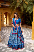 Blue Dola Silk lehenga choli with Batik print and gold Zari weaving detail.