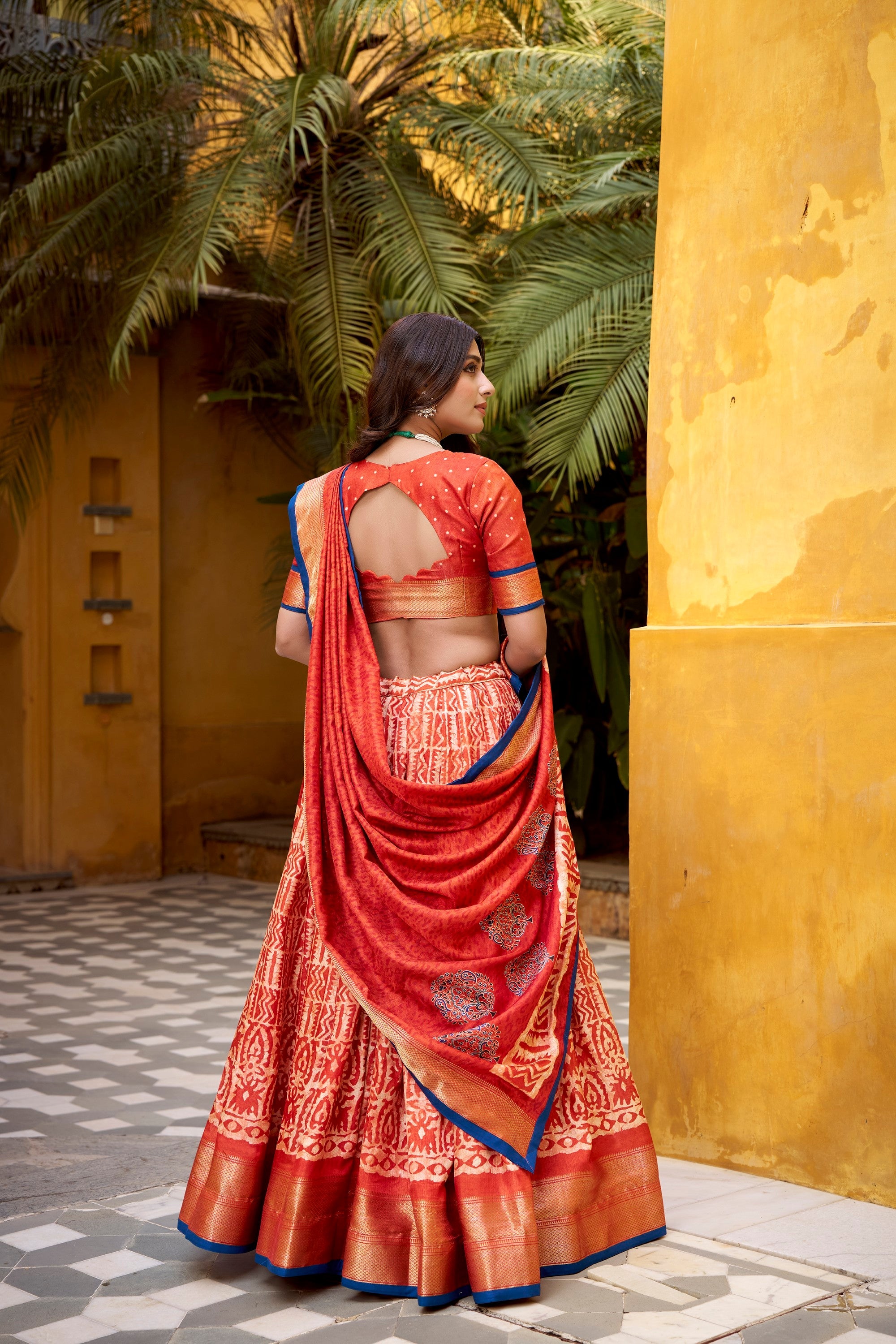Rust Dola Silk Batik Print Lehenga Choli with Zari Weaving