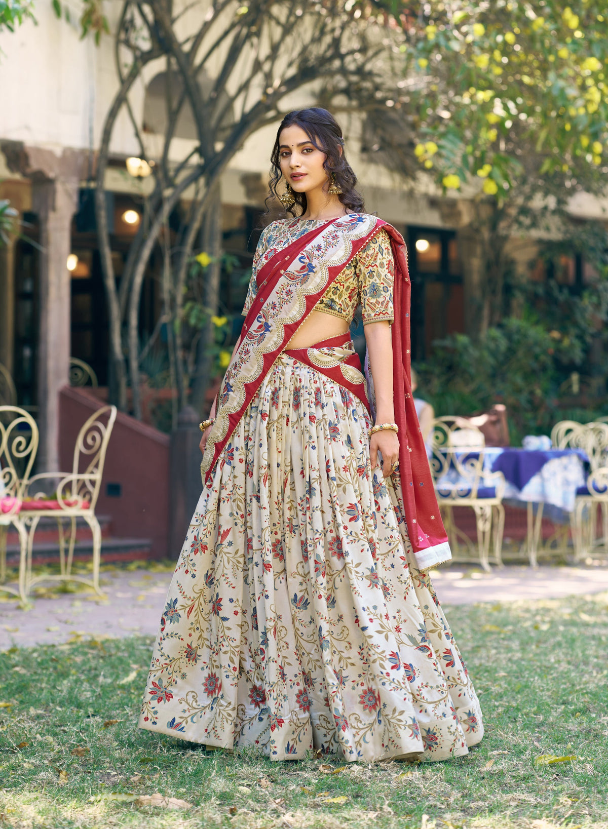 Offwhite Tasar silk lehenga choli with gilded motif foil prints and matching dupatta.