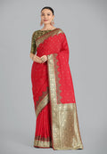 A vibrant red Banarasi silk saree with intricate golden zari weaving and a traditional designer pattern.