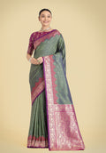 Olive Green Banarasi Silk saree with intricate gold Zari woven patterns.