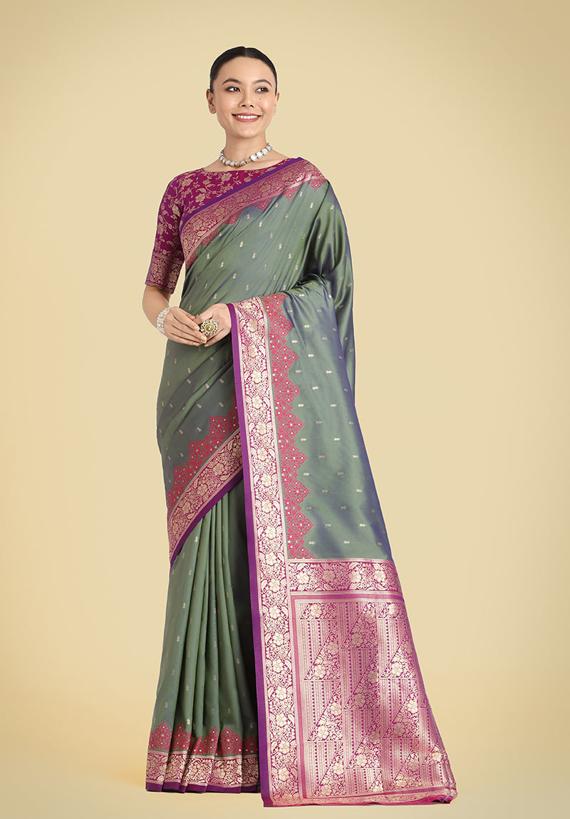 Olive Green Banarasi Silk saree with intricate gold Zari woven patterns.