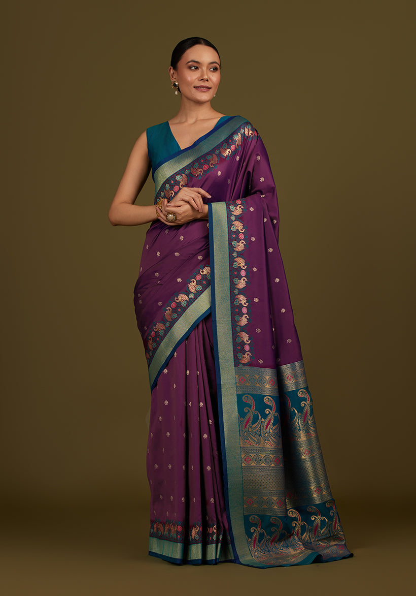 Monjolika Fashion Dark Purple Banarasi Silk Blend SareeIn Classic Paisley & Rich Zari Pallu Comes With Unstitched Blouse