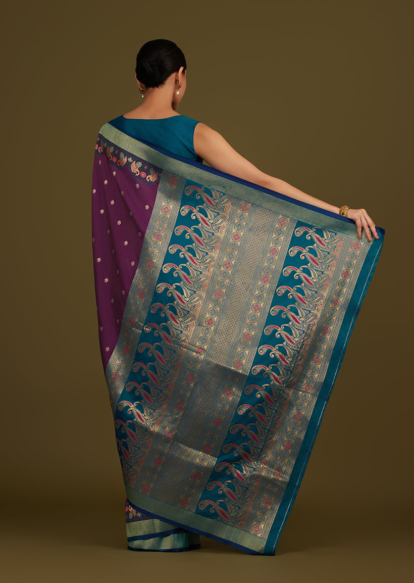 Monjolika Fashion Dark Purple Banarasi Silk Blend SareeIn Classic Paisley & Rich Zari Pallu Comes With Unstitched Blouse