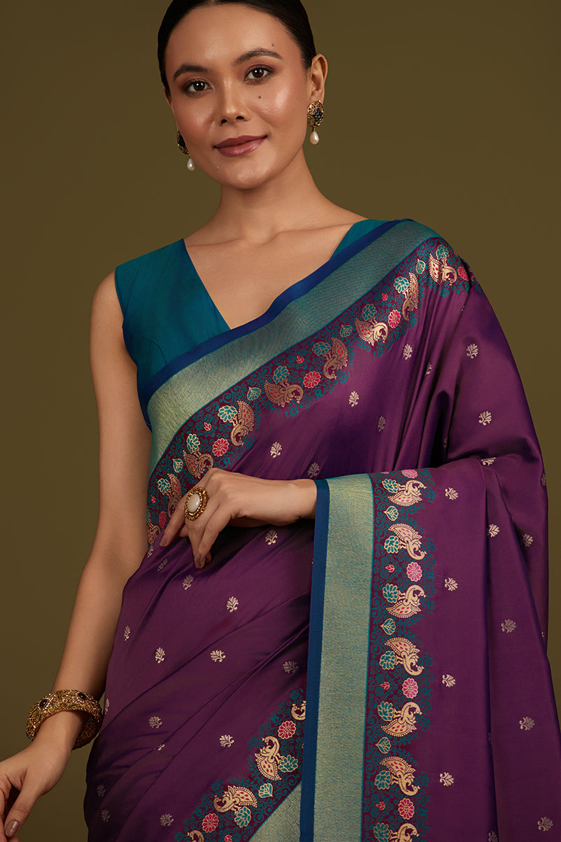 Monjolika Fashion Dark Purple Banarasi Silk Blend SareeIn Classic Paisley & Rich Zari Pallu Comes With Unstitched Blouse