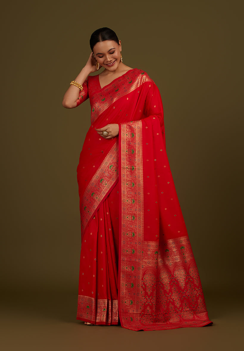 Elegant red Banarasi silk blend saree with intricate gold zari woven brocade motifs