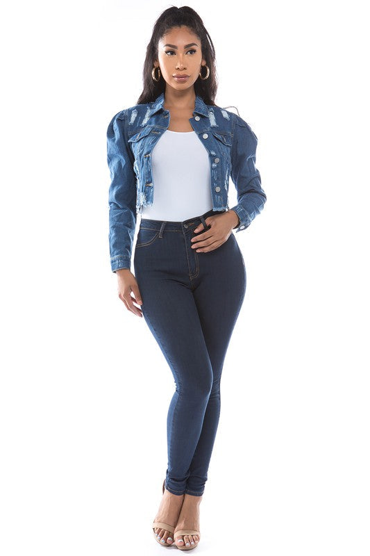Close up of a classic cropped denim jacket showing the collar and button details