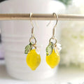 Colorful leaf-shaped frosted resin pendant earrings with gold-tone hook closures