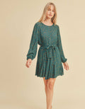 Bristol Dress in teal with abstract orange spots, long sleeves, and button closure