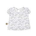A white girls blouse with a blue berry and leaf floral print, featuring puff sleeves and a tie-neck detail on a clean background.
