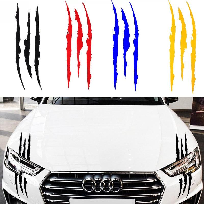 Reflective monster claw mark vinyl decal applied to a car headlight