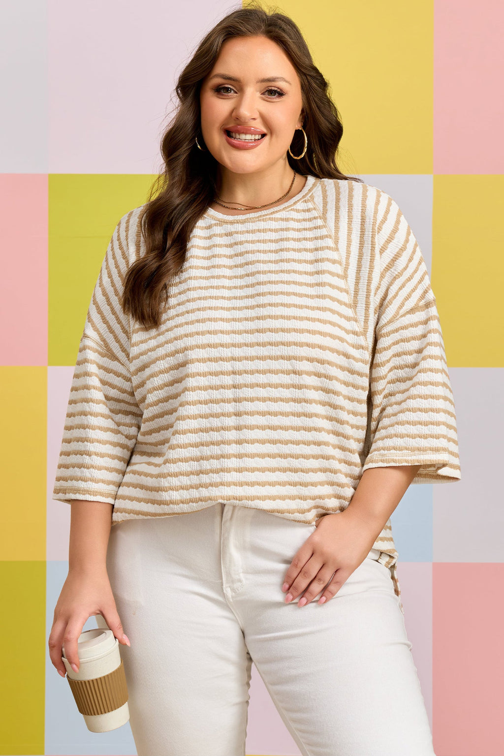 Close-up of the Liv Detail half sleeve striped knit top in white and tan colors.