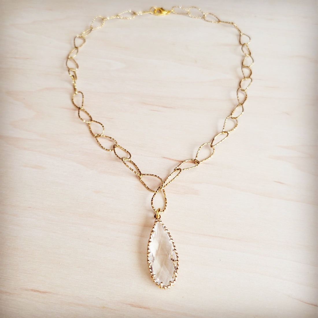 Gold-Tone Teardrop Pendant Necklace with Textured Oval Links - Image 2