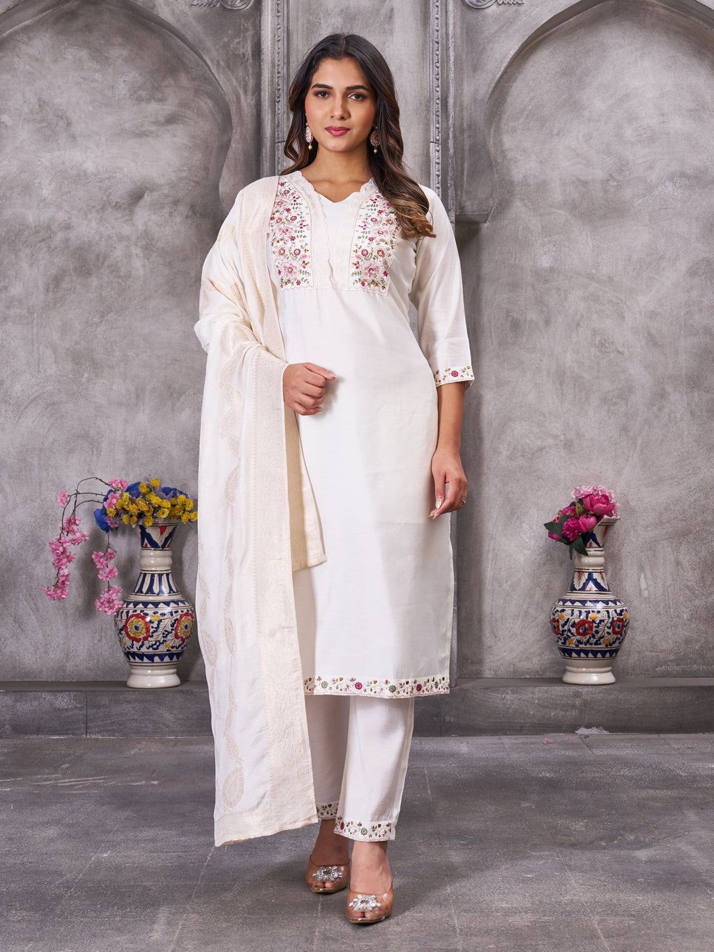 White Roman Silk kurta set featuring multi-color embroidery, sequins, and straight-cut pants.