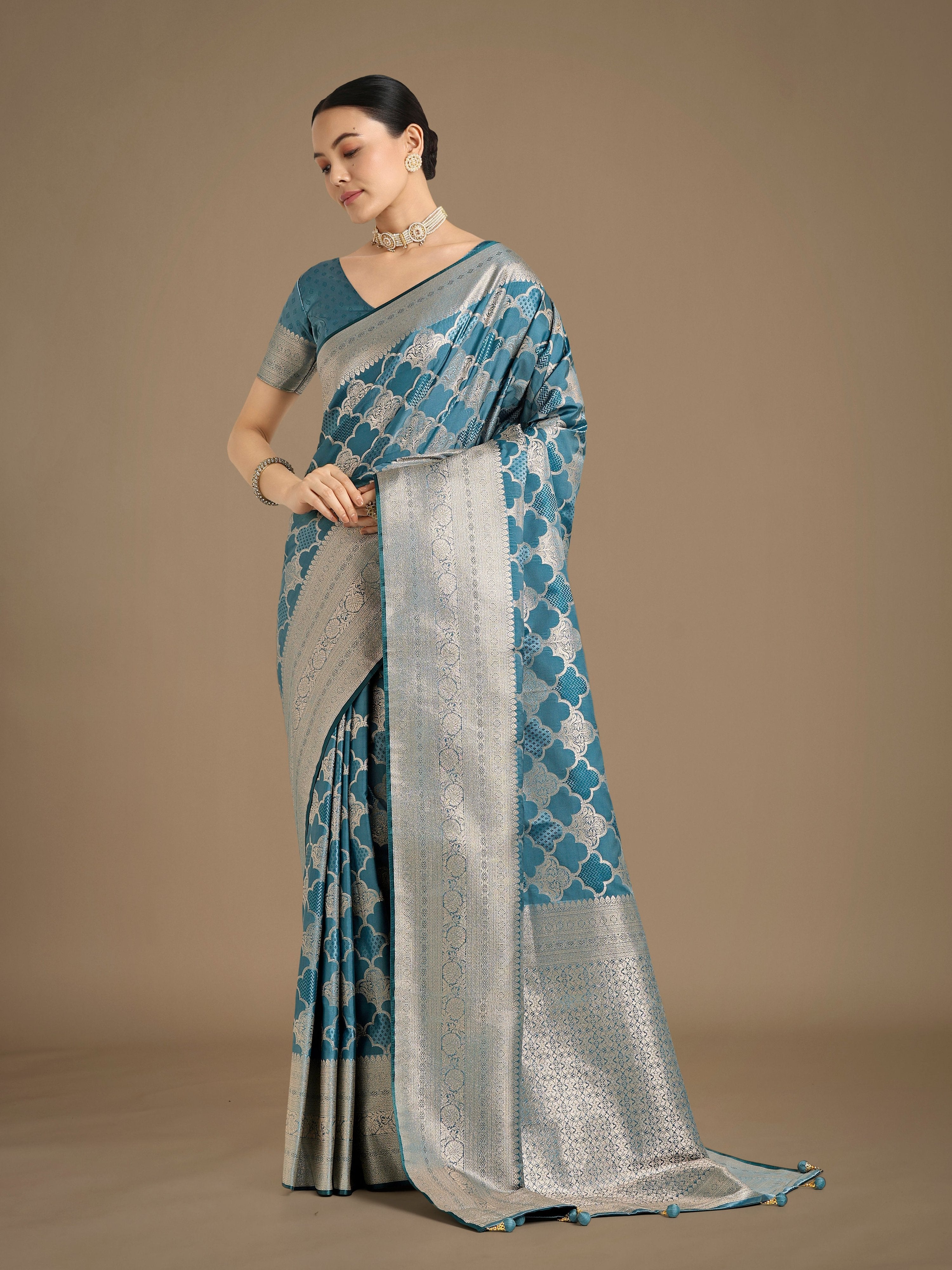 Cyan blue Banarasi Satin Silk saree featuring a rich, intricate gold Zari woven pallu