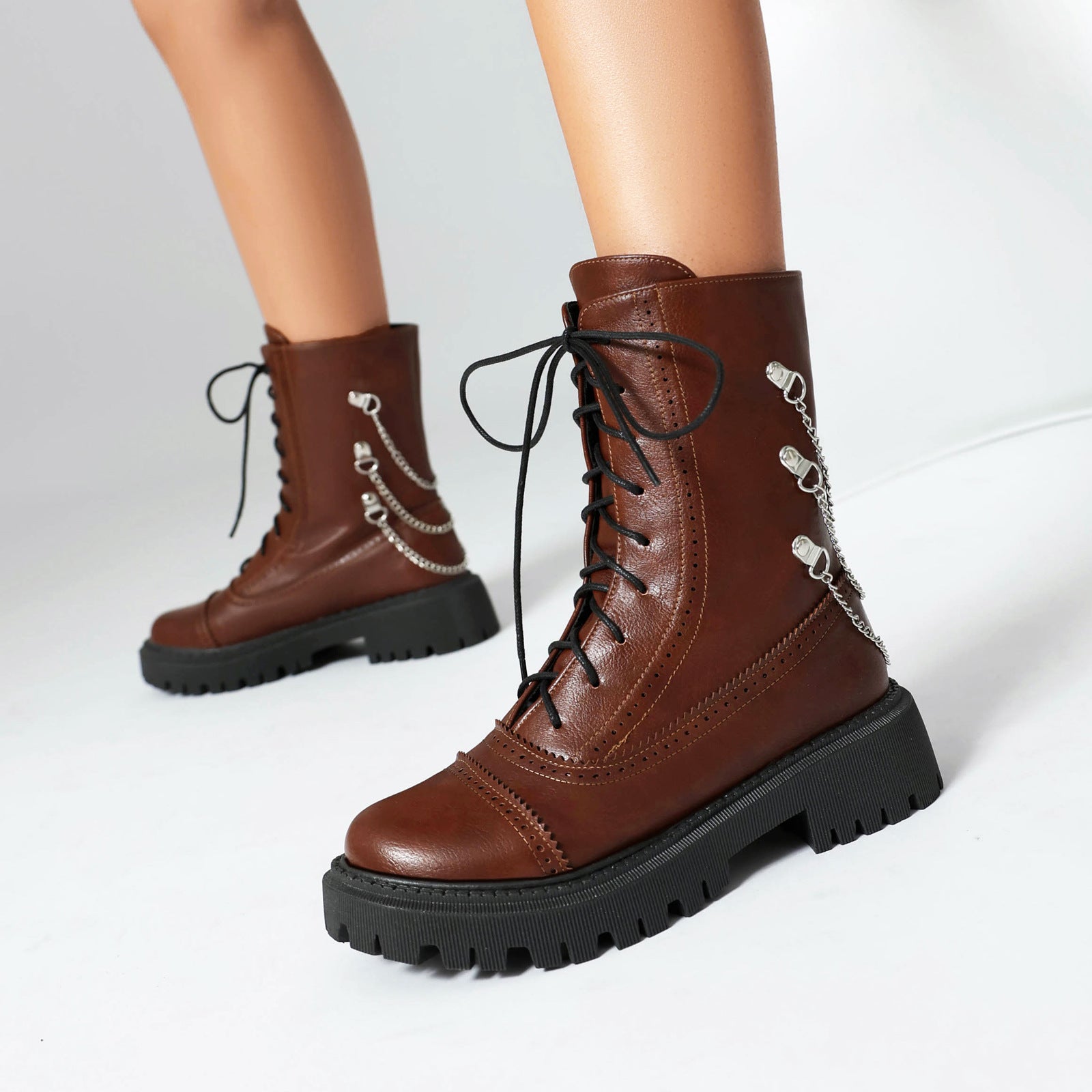 Women's mid-calf lace-up boots with chunky heels and side chain detail in brown and burgundy