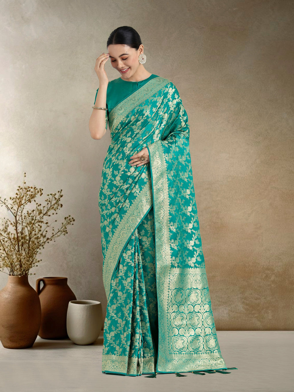 Effervescent turquoise Banarasi satin silk saree featuring delicate Zari weaving and matching blouse fabric.