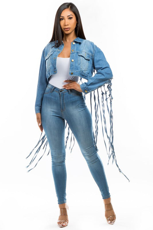 Close-up of a women's stylish cropped denim jacket featuring a modern silhouette.