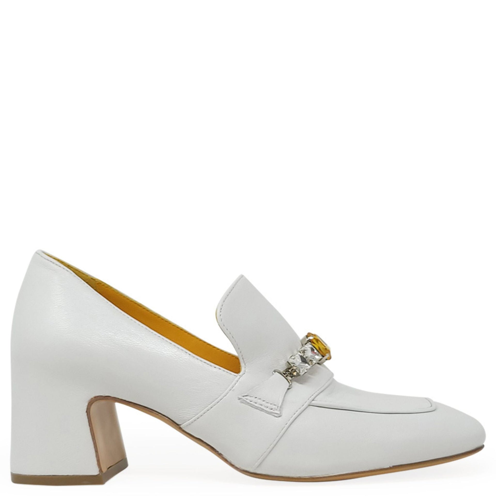A pair of white leather block-heel loafers decorated with a large crystal and amber-colored jeweled strap.