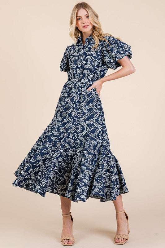 Close up of a leaf pattern eyelet lace dress with puff sleeves