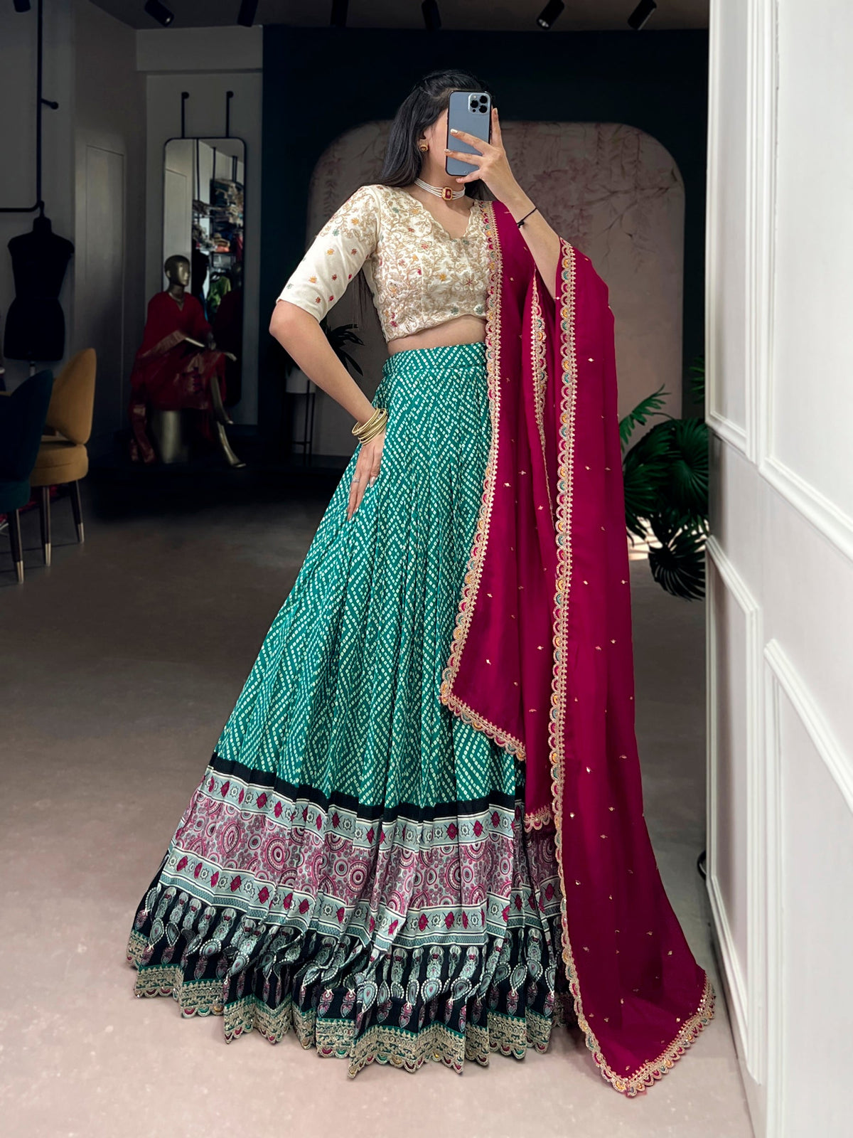Bottlegreen rayon lehenga choli set with Bandhej and Ajarakh print and embroidery.