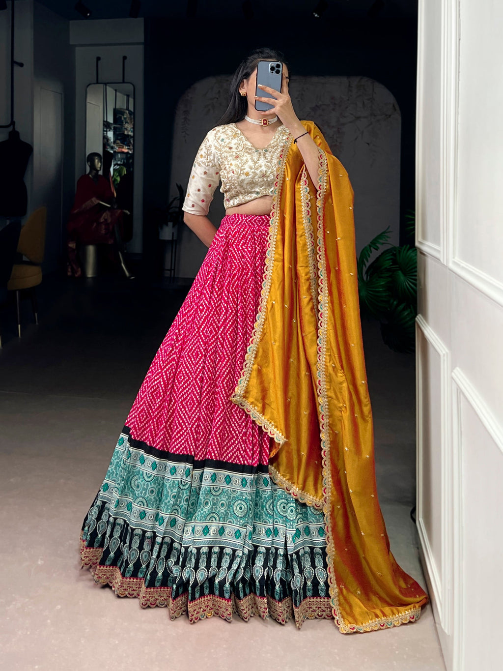 Pink Rayon lehenga choli with Bandhej and Ajrakh print, sequins, and thread embroidery