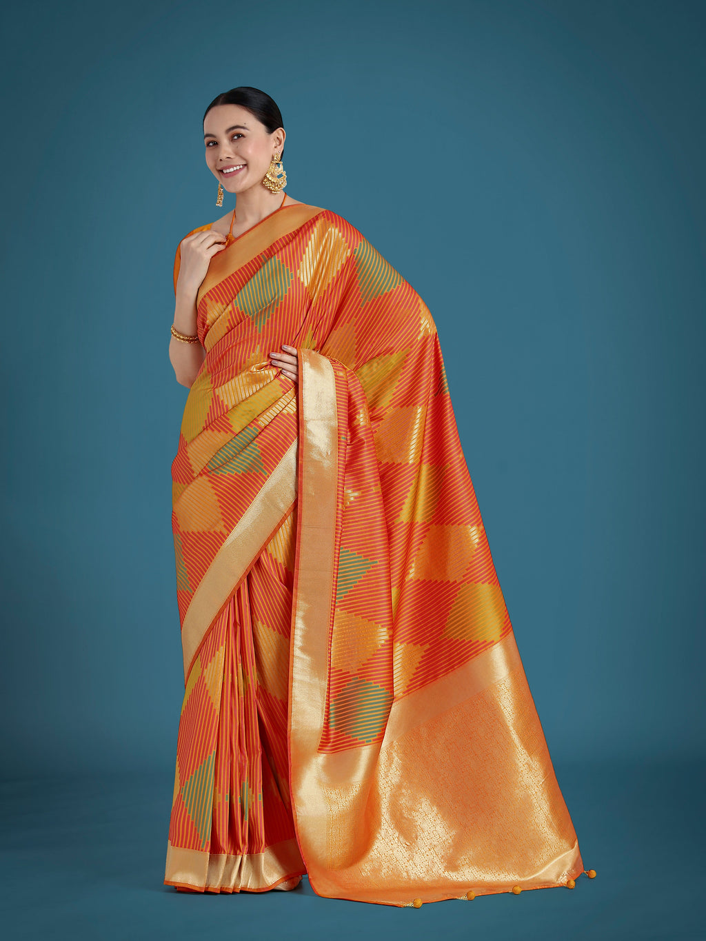 Classic vibrant orange Banarasi silk saree with intricate gold Zari weaving patterns.