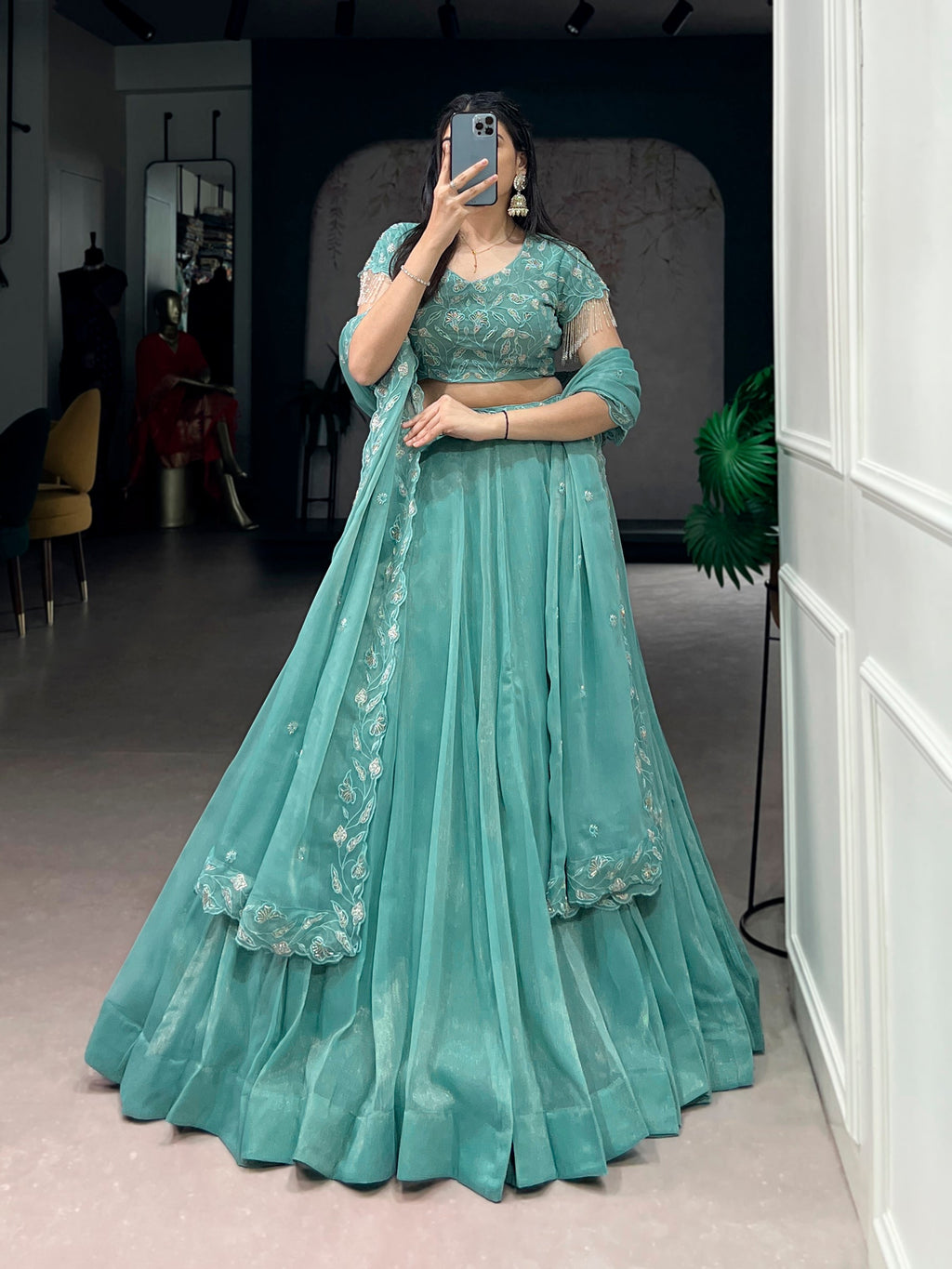Seagreen lehenga choli with intricate gold coin beads and delicate thread embroidery