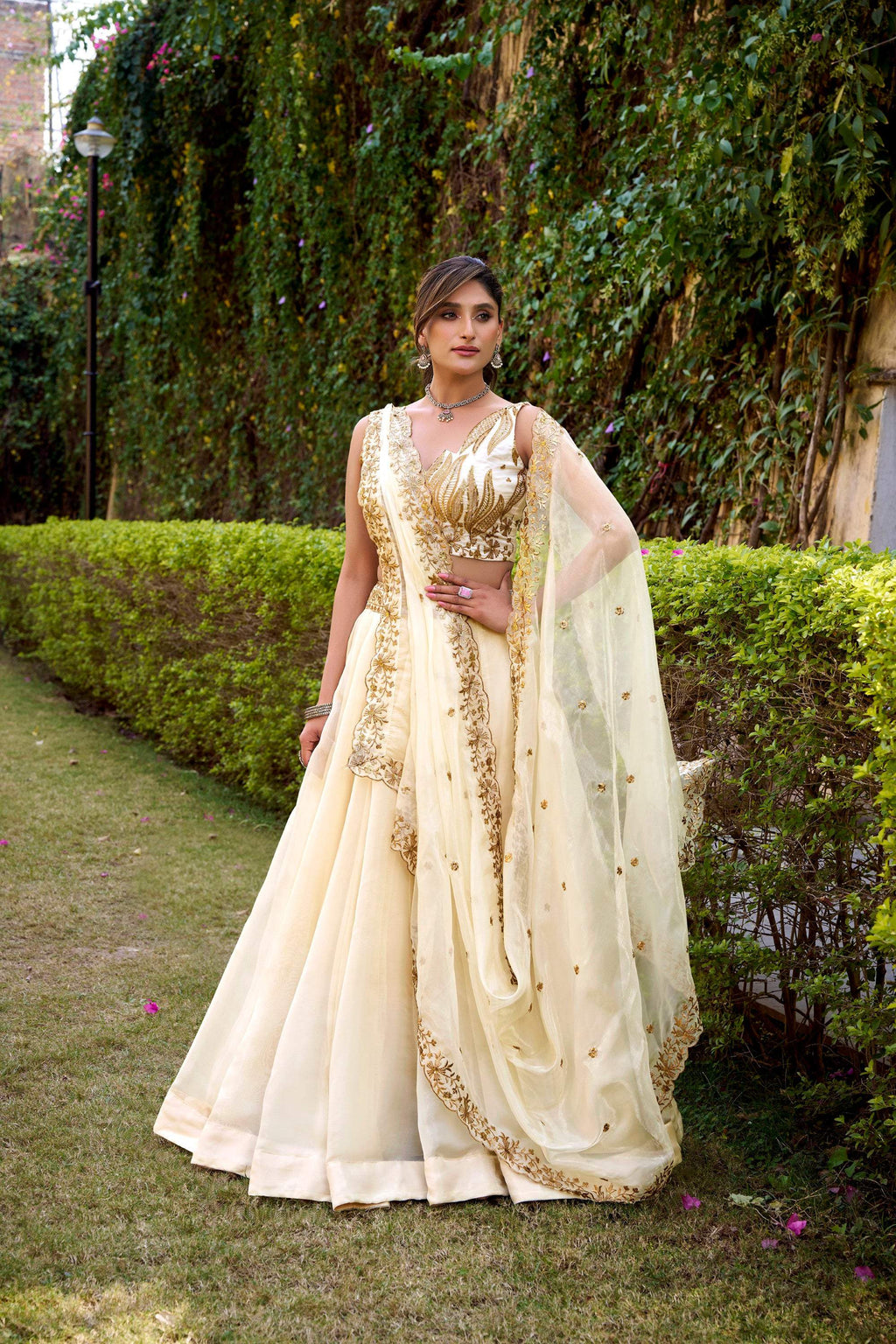 Off-white Chanda Silk lehenga choli with intricate sequin and thread embroidery and matching belt