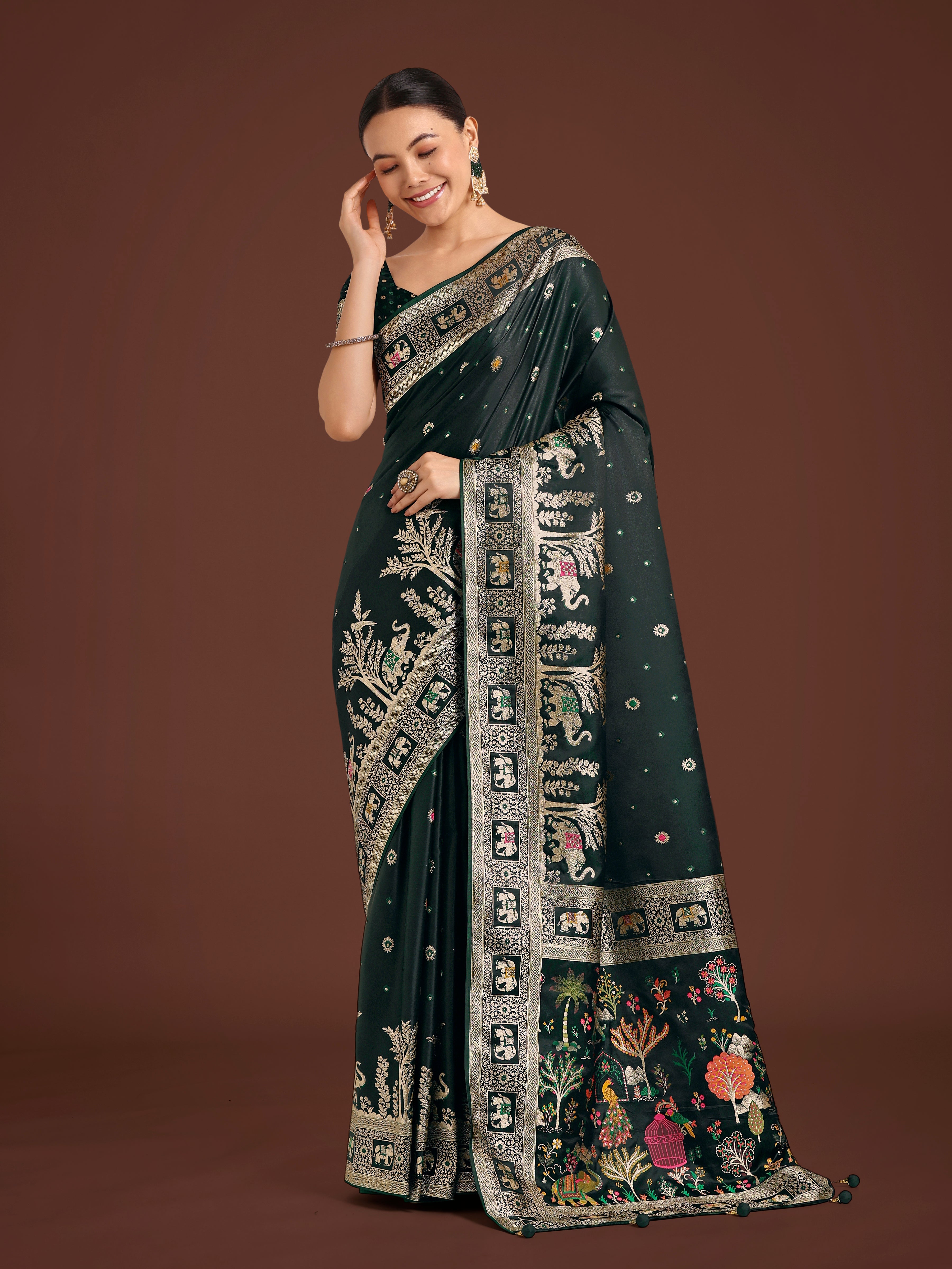 Dark green Banarasi satin silk saree with detailed gold zari weaving