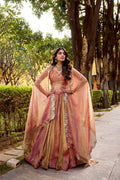 A plain rust-colored Carika silk lehenga choli set with a matching dupatta.
