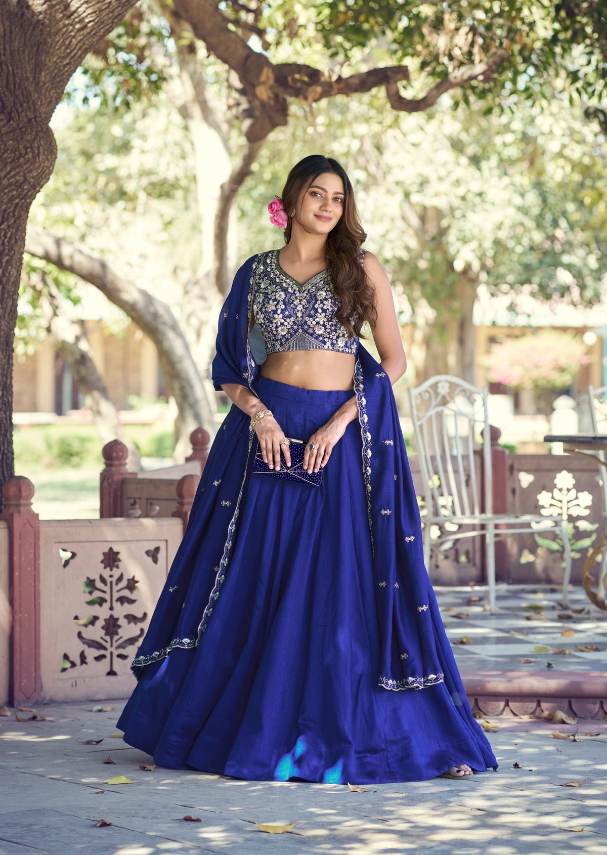 Royal Blue P.C. Kashmiri lehenga choli set with dupatta worn by a model