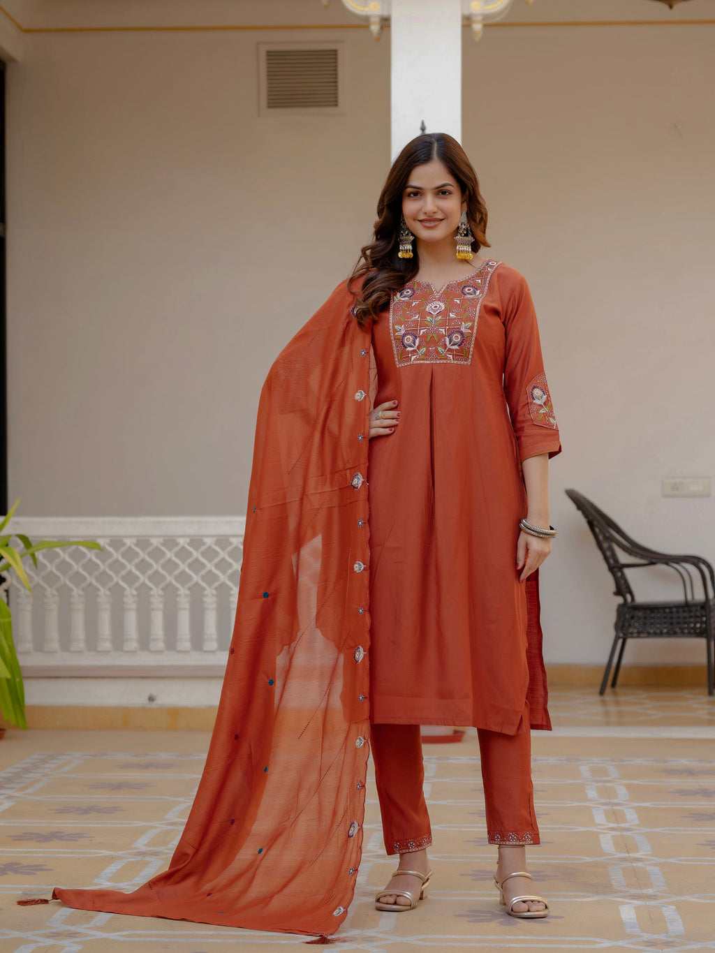 Rust colored pure viscose mango silk kurta set with detailed hand-embroidery and sequins