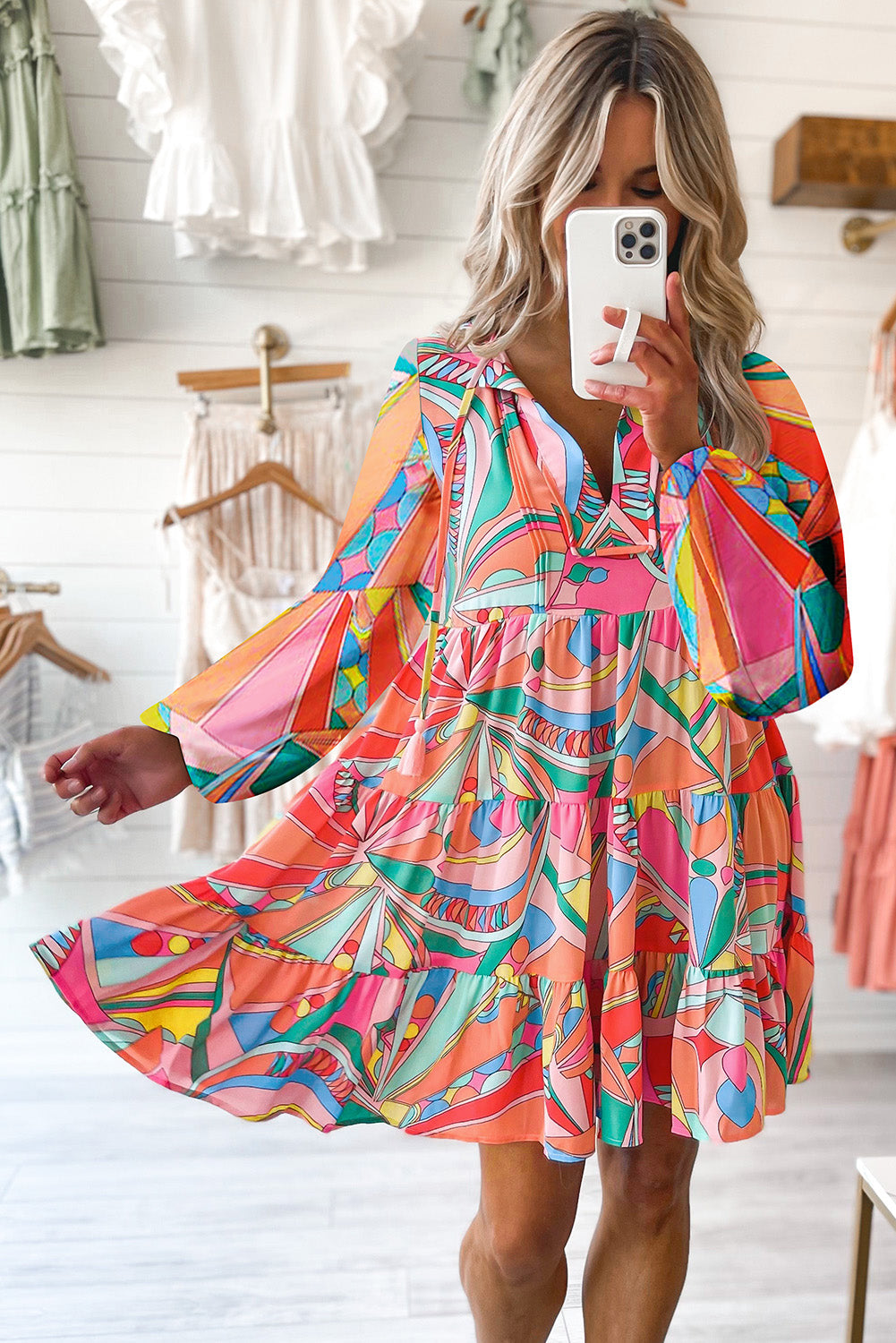 Colorful abstract print mini dress with tie neck detail