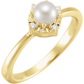Pearla Diamond Halo Ring featuring a central freshwater pearl with a diamond halo set in gold