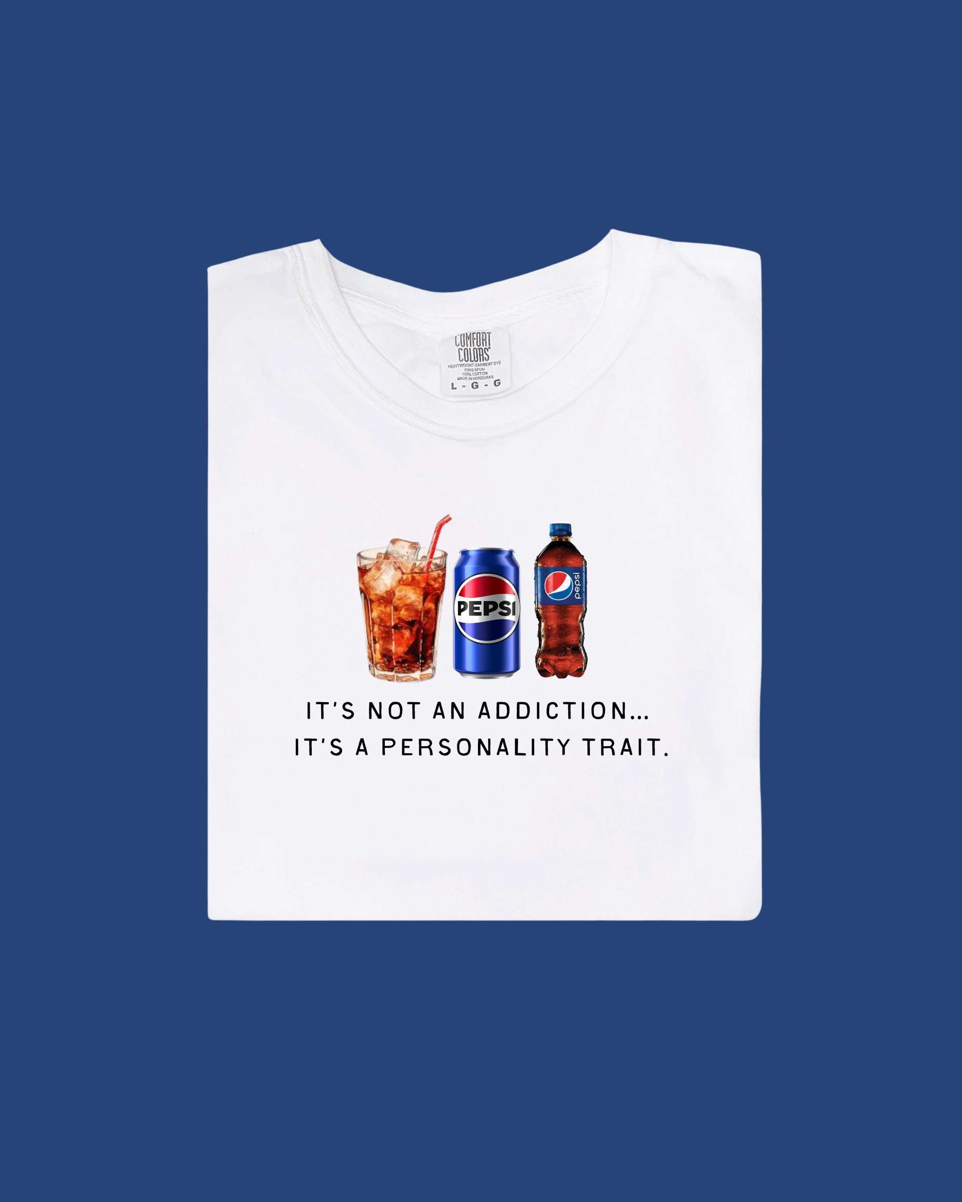 Close up of the It's Not An Addiction Regular Pepsi graphic t-shirt on a neutral background