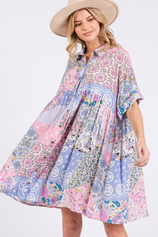 Feminine pink multicolor floral mini shirt dress with a classic collar and half sleeves.