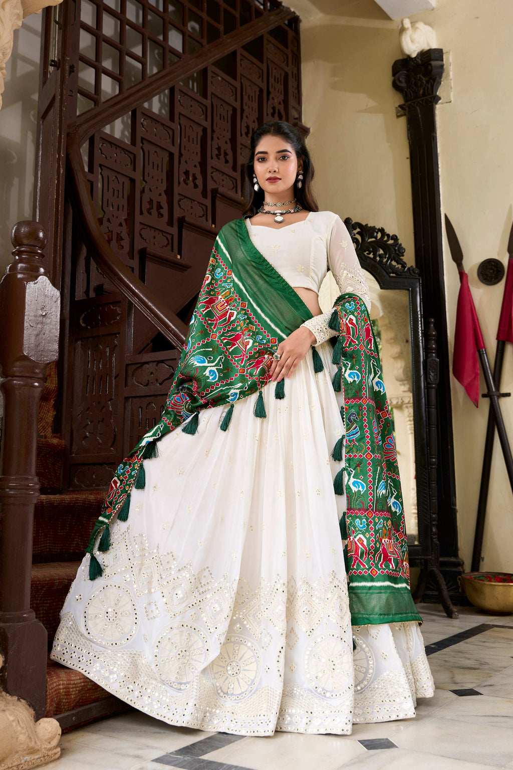 White georgette lehenga choli with intricate Lucknowi paper mirror work detail
