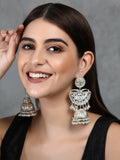 Silver tone ghungroo jhumka earrings with intricate patterns and sparkling stone accents