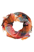 Woman wearing a cozy plaid pattern infinity scarf in a circular loop style