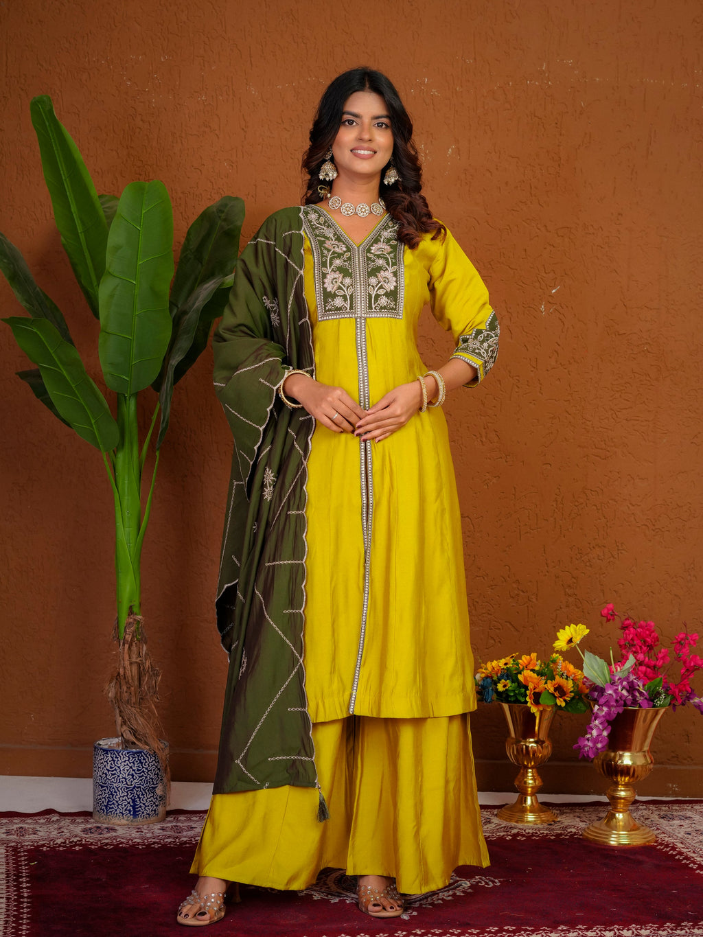 Mustard Roman Silk kurta with multi-thread embroidery and hand work, styled with palazzo pants and dupatta.