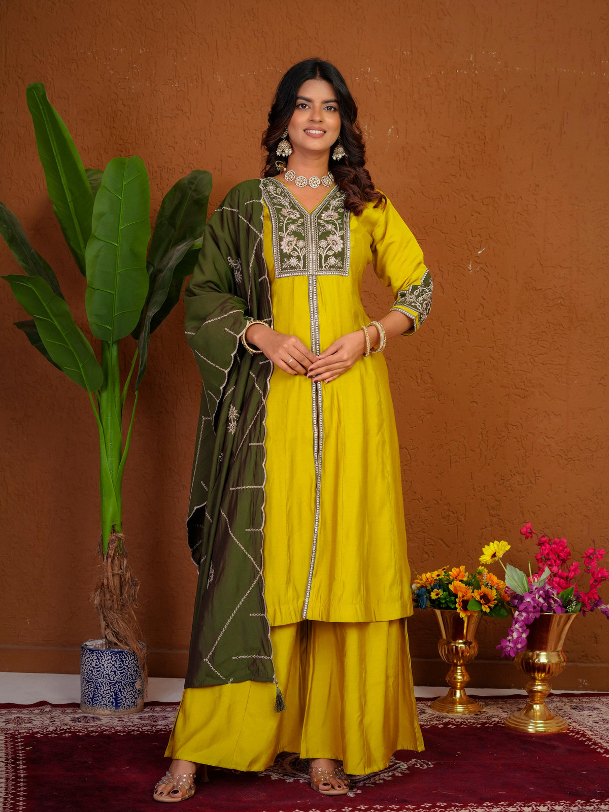 Mustard Roman Silk kurta with multi-thread embroidery and hand work, styled with palazzo pants and dupatta.