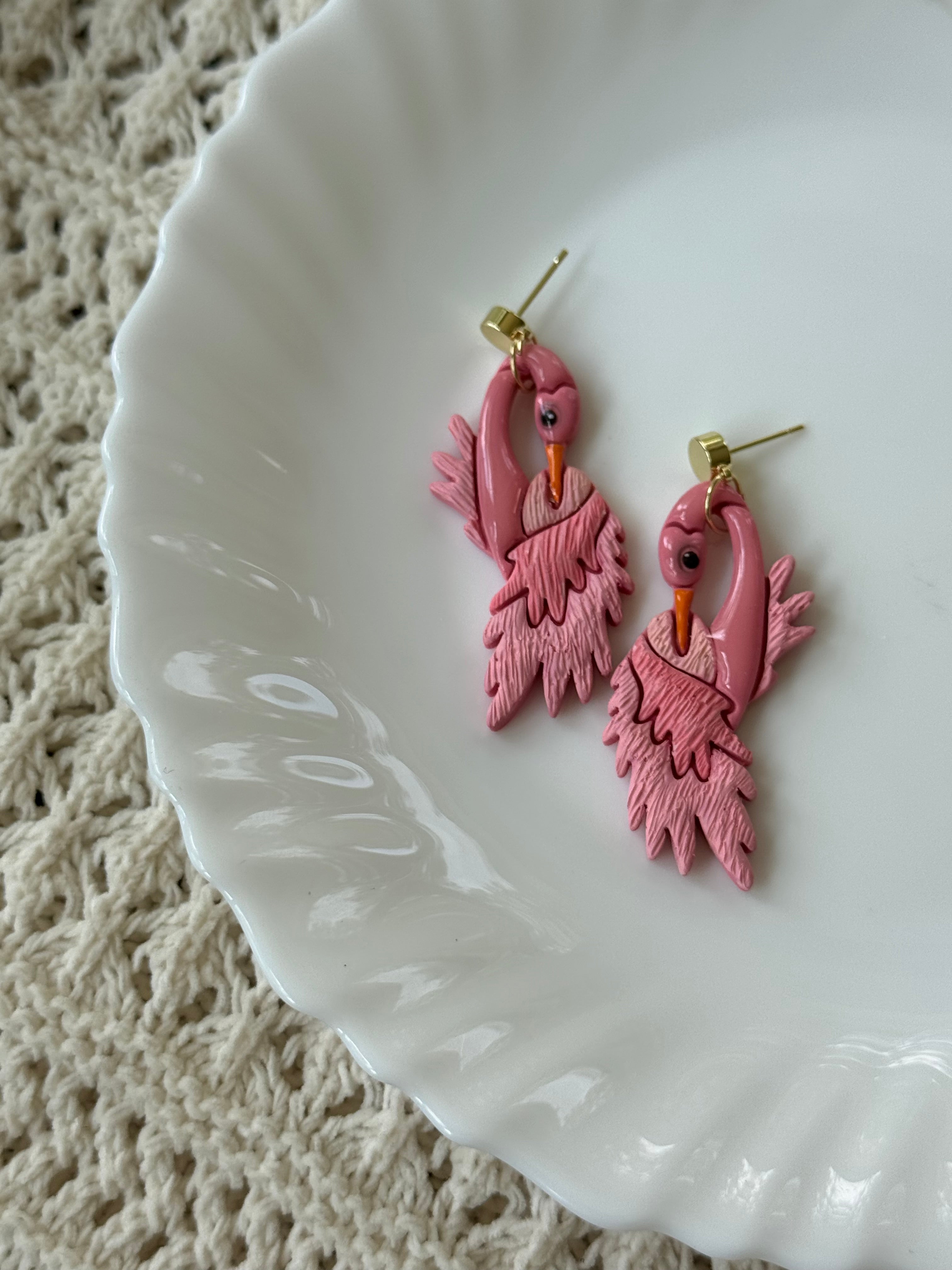 Handcrafted Flamingo earrings in pink, gold, and orange polymer clay.