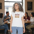 Women wearing a flowy muscle tee with rolled cuffs and a raw hi-low hem in solid charcoal
