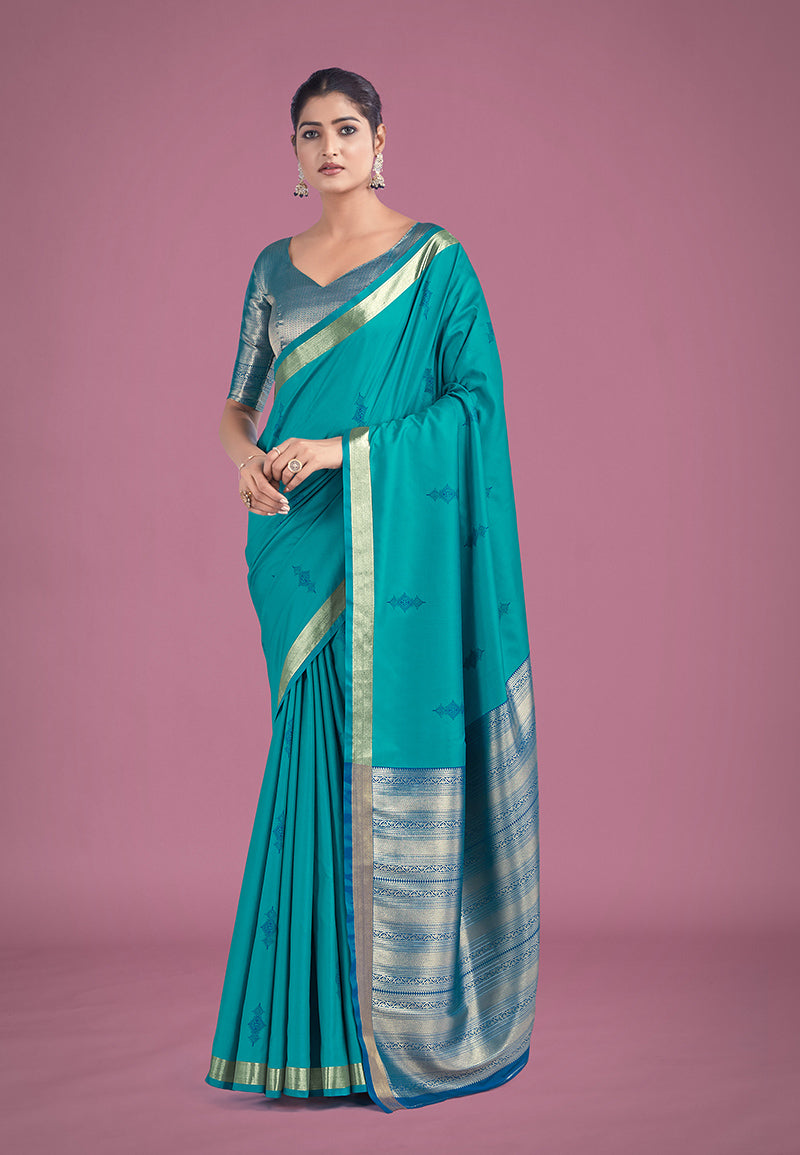 Turquoise silk saree with intricate golden zari woven border for ceremonies
