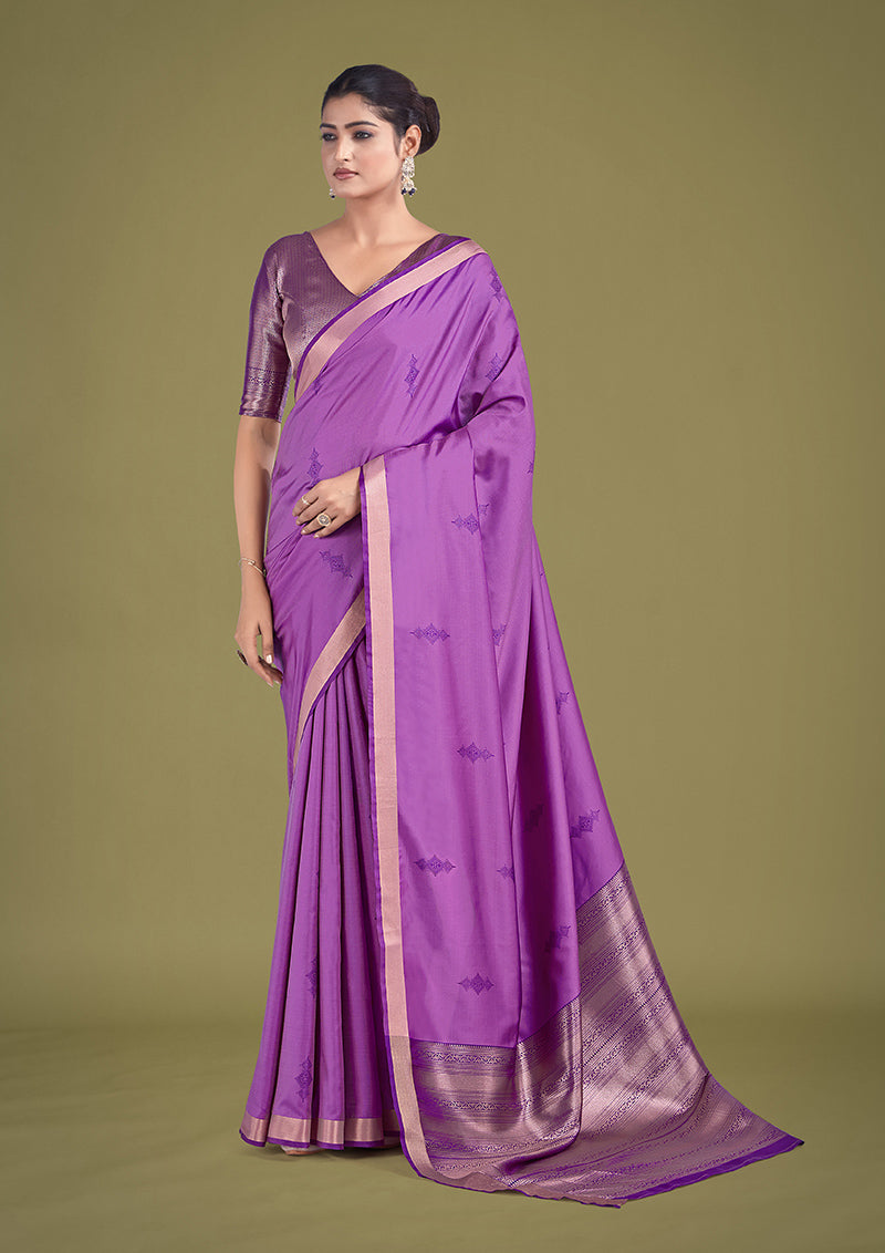 Charming lavender silk saree with intricate golden zari woven border for traditional ceremonies