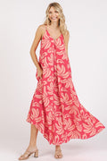 Printed V-neck maxi cami dress featuring a flowy silhouette and side pockets