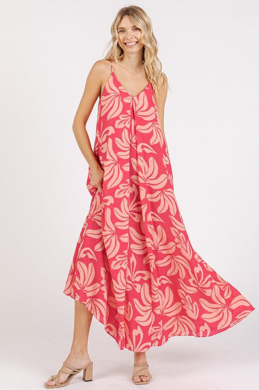 Printed V-neck maxi cami dress featuring a flowy silhouette and side pockets