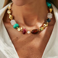 Bohemian layered necklace featuring colorful resin and CCB beads on a gold-tone alloy base.